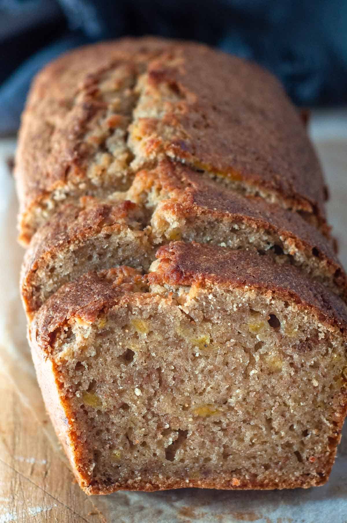 sliced banana bread pieces on a serving board