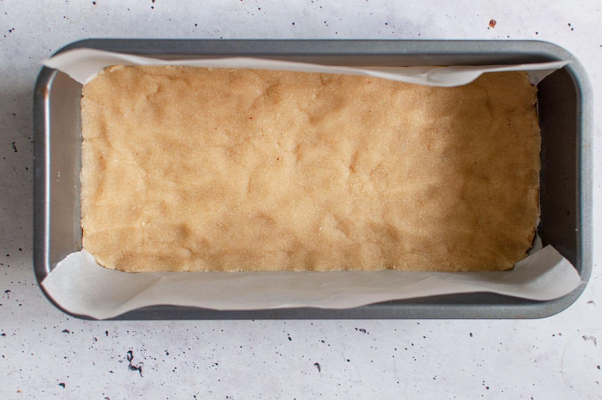 lemon bar base pressed into a loaf tin