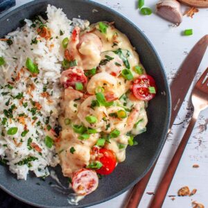 creamy garlic prawns and rice in a bowl