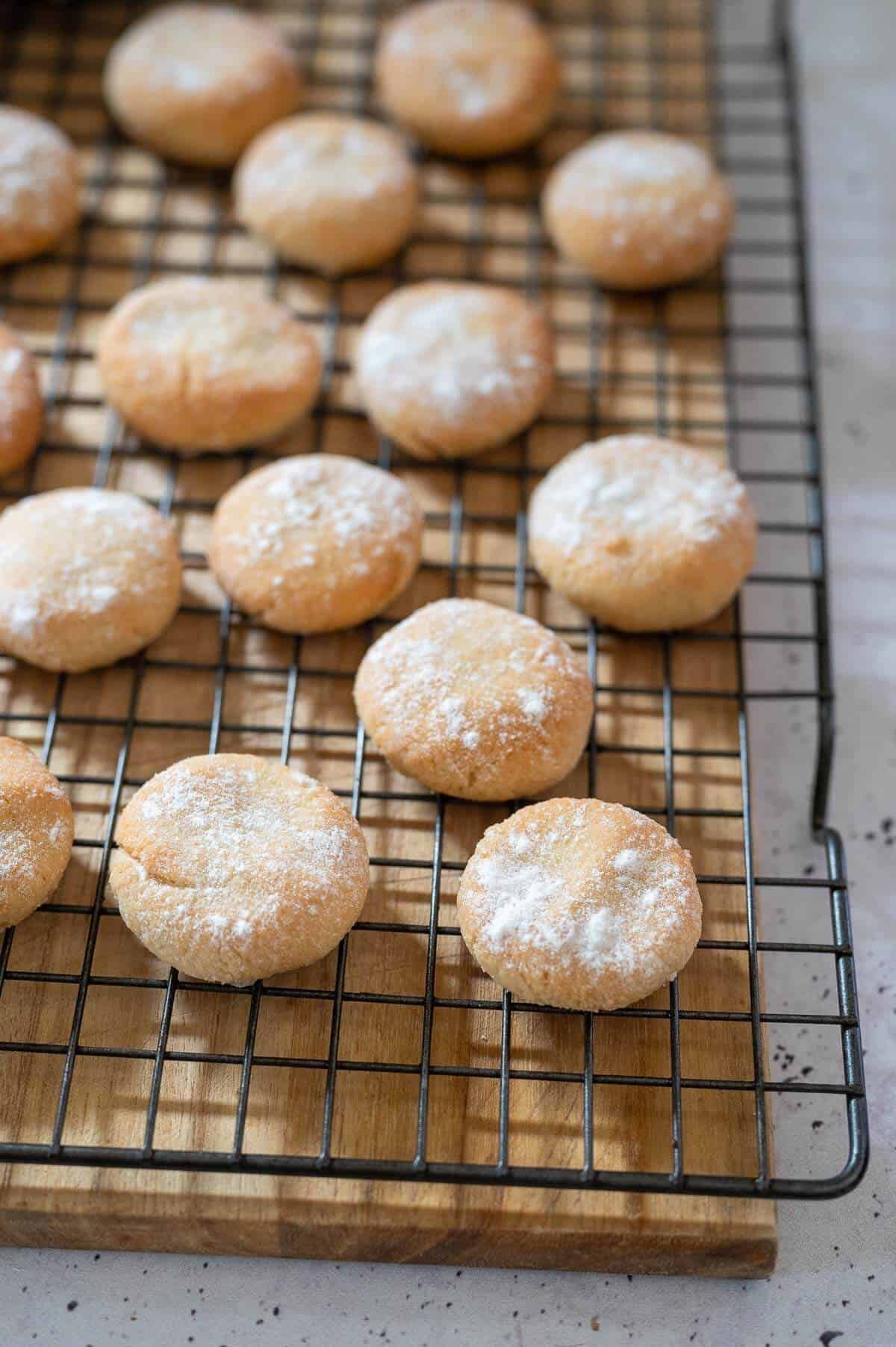 cooked amaretti biscuits scattered on a wire rack