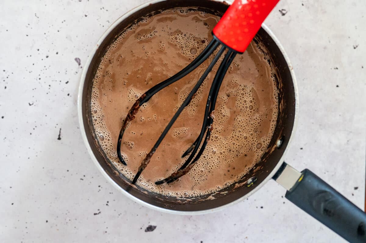 mixing panna cotta ingredients in a pot