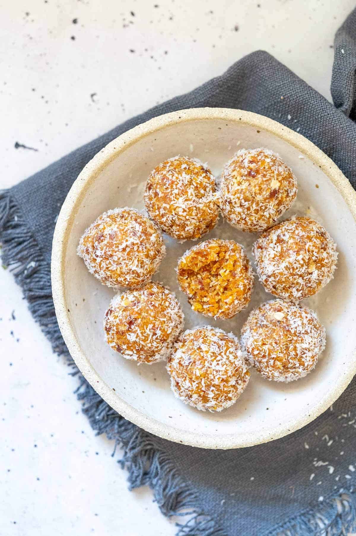 8 apricot bliss balls on a plate