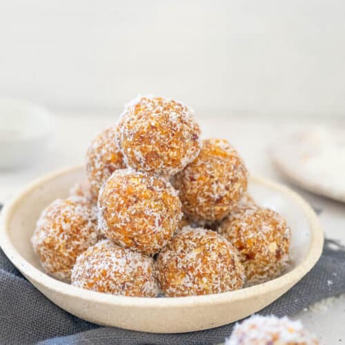 small bowl with apricot and coconut balls stacked