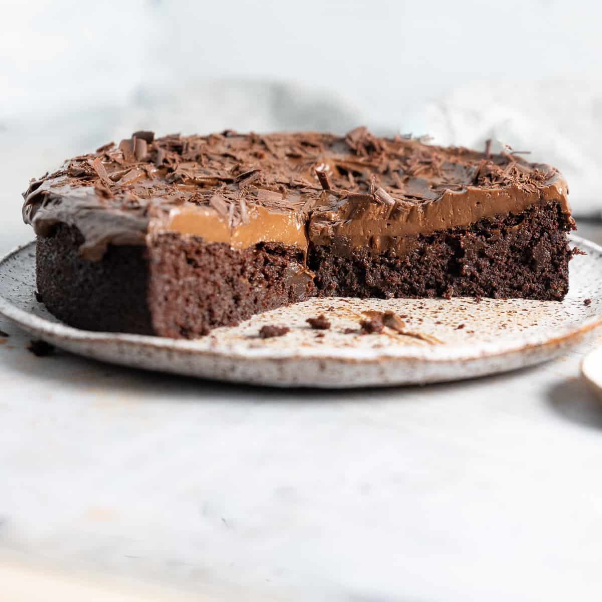 half a Black bean chocolate cake on a plate 