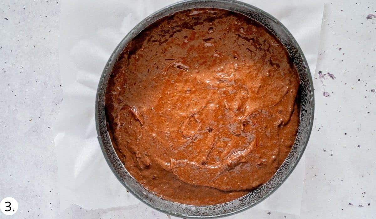 chocolate black bean cake batter  in cake tin before cooking