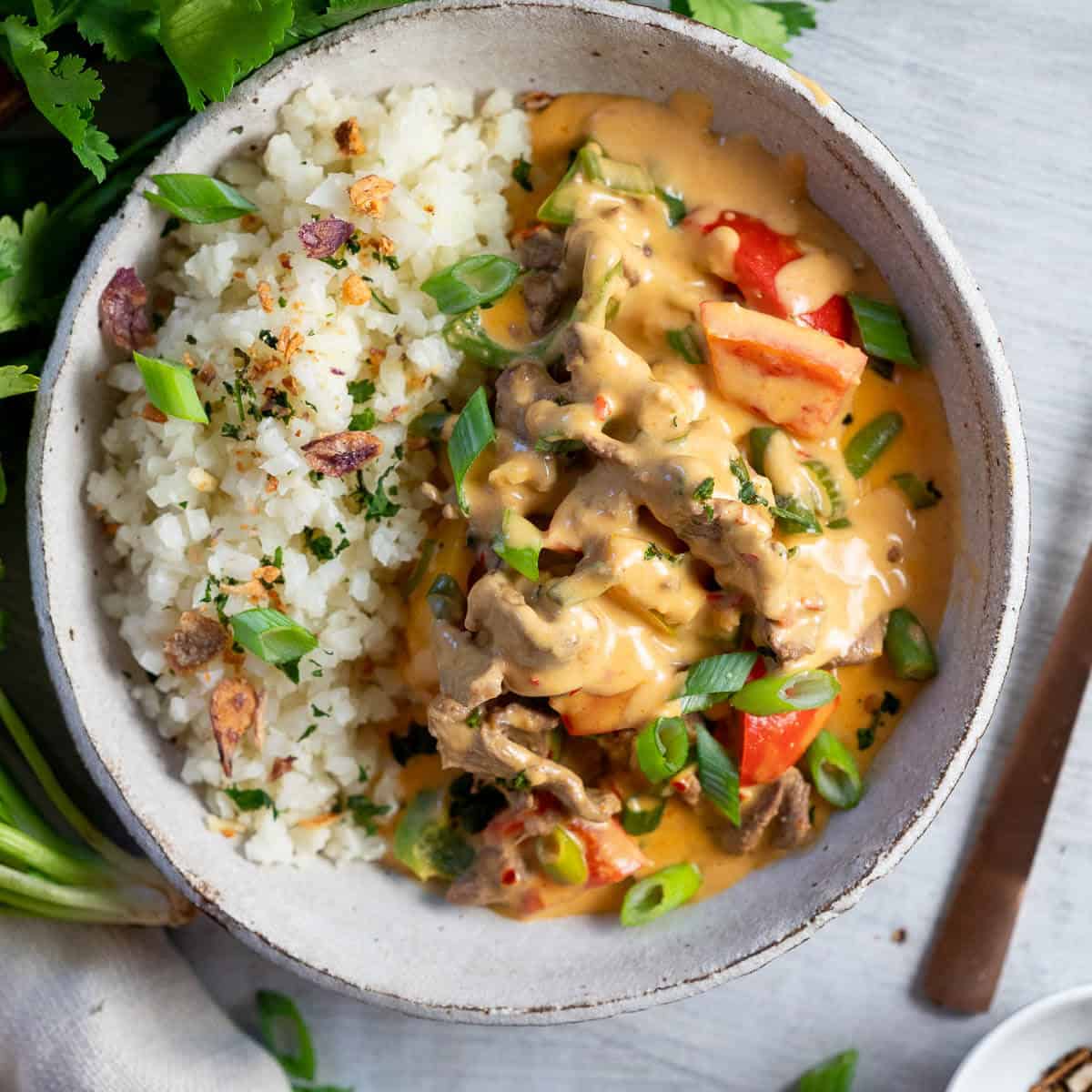 A bowl of beef satay curry with cauliflower rice