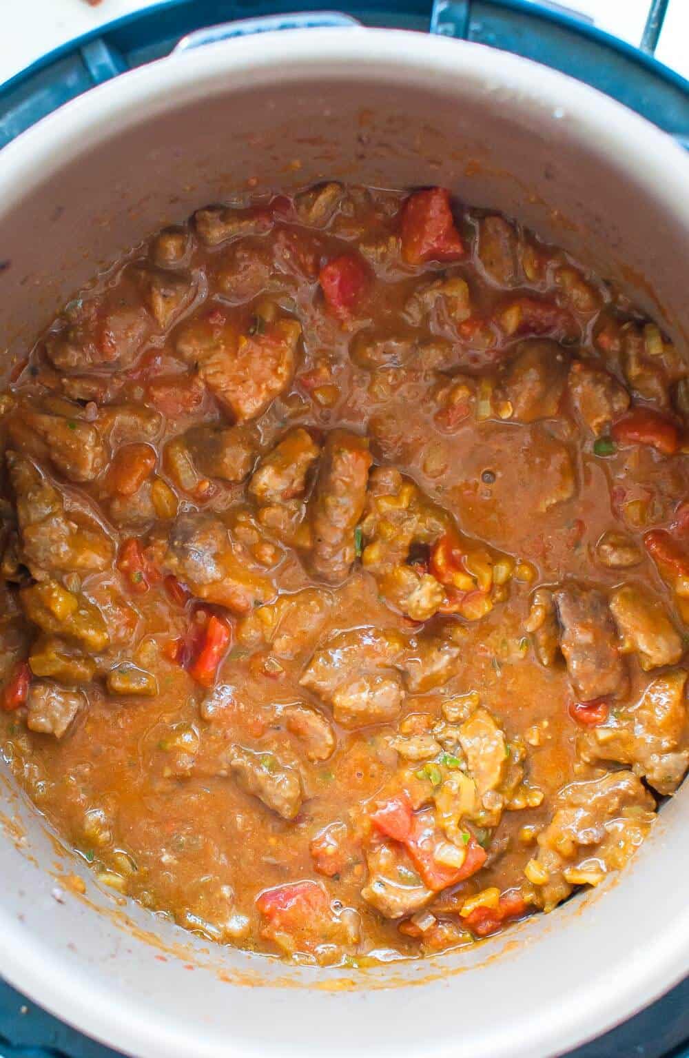 cooked beef masala in pressure cooker pot 