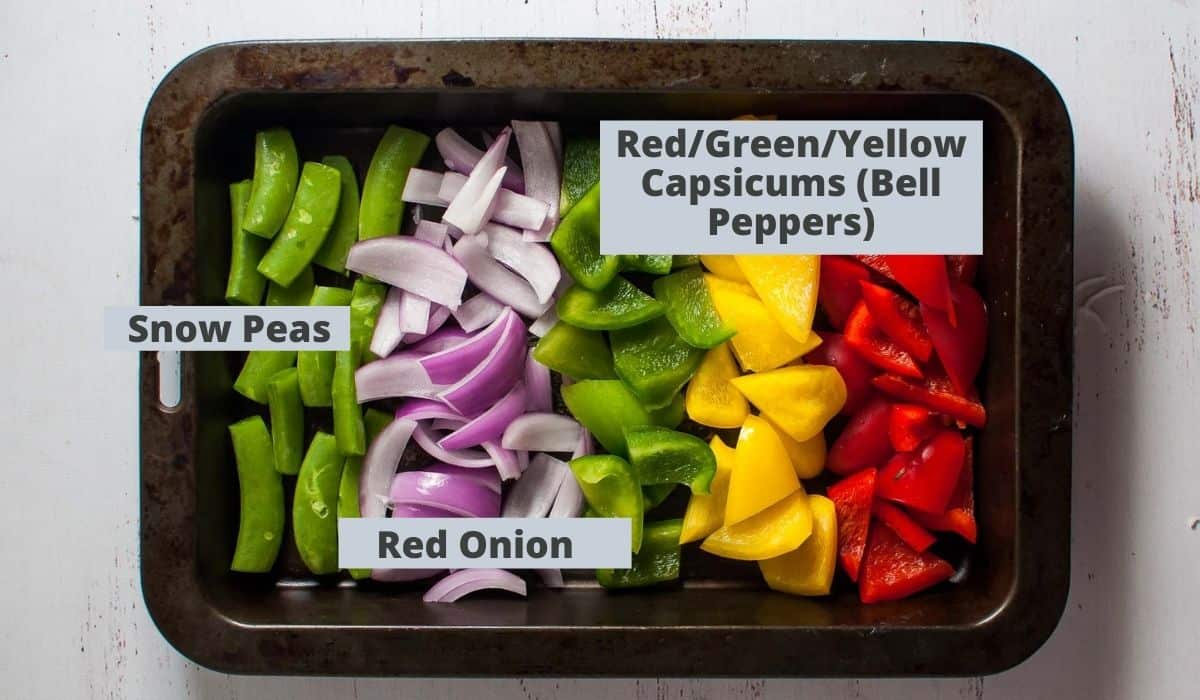 chopped vegetables in a rectangle metal tray