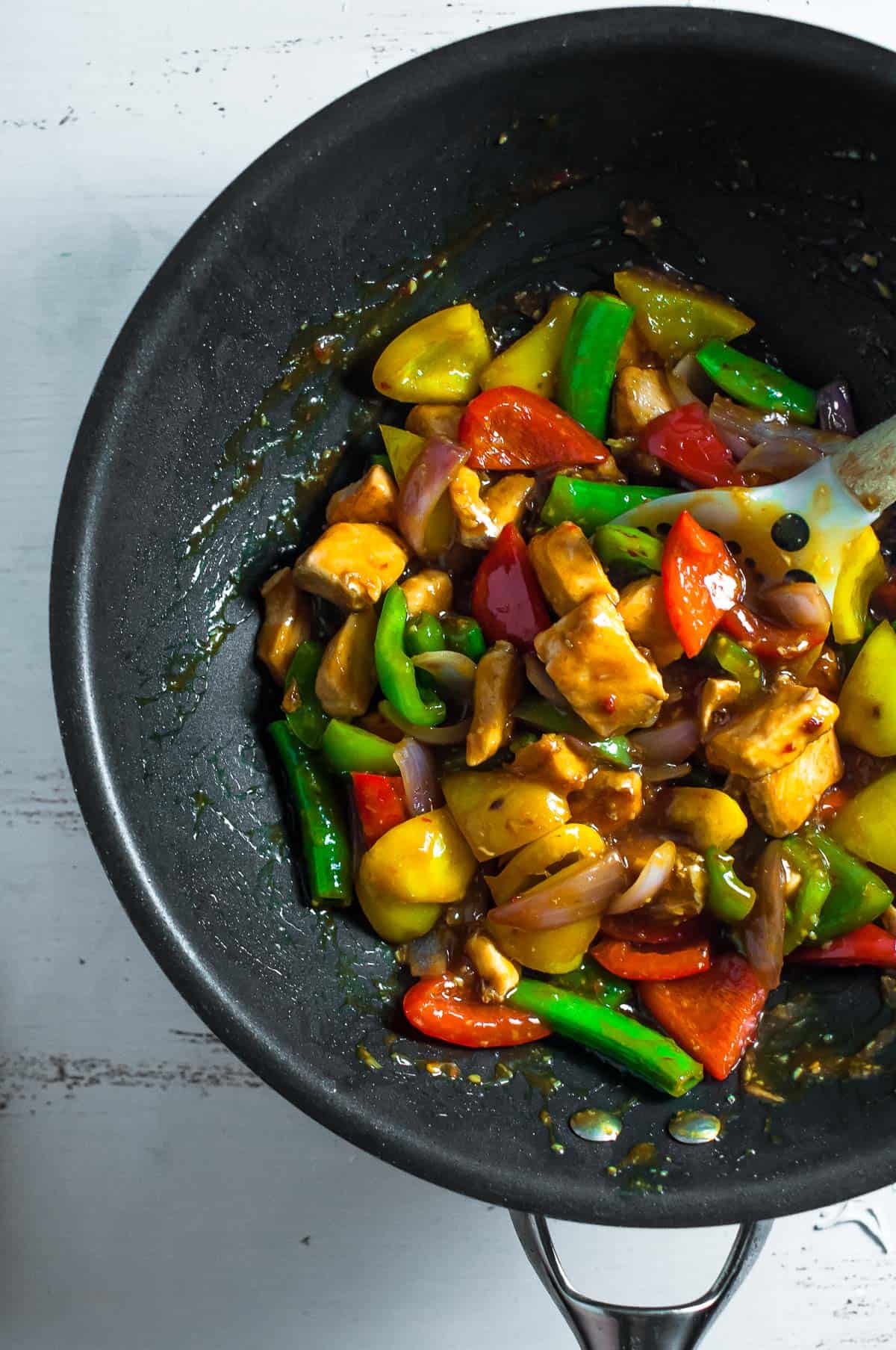 Salmon stir fry cooking in a wok
