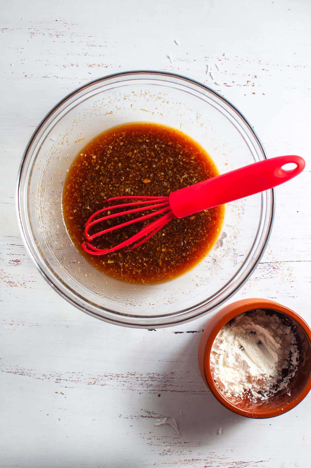 Stir fry sauce in a jug with a whisk