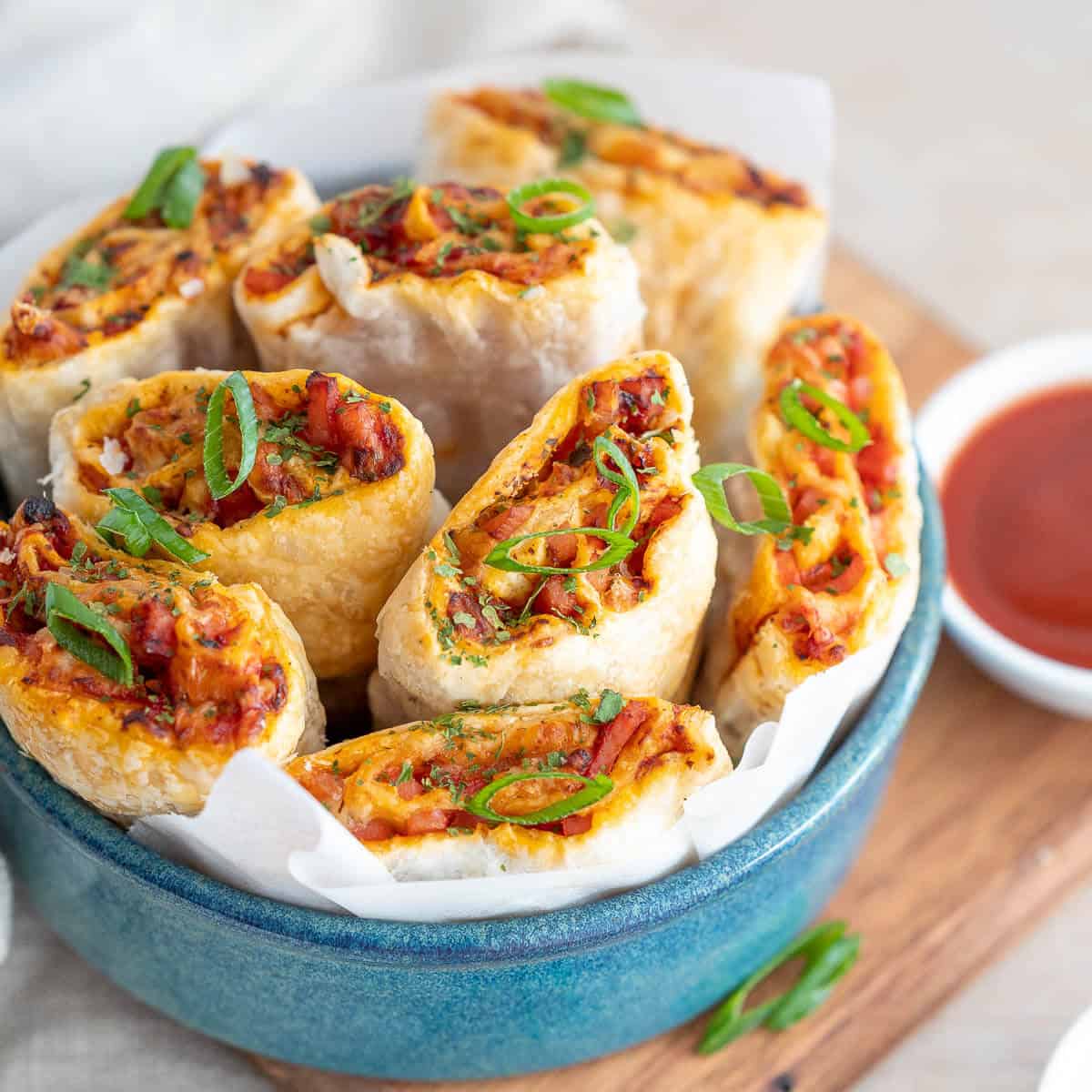 air fryer pizza rolls in a blue bowl