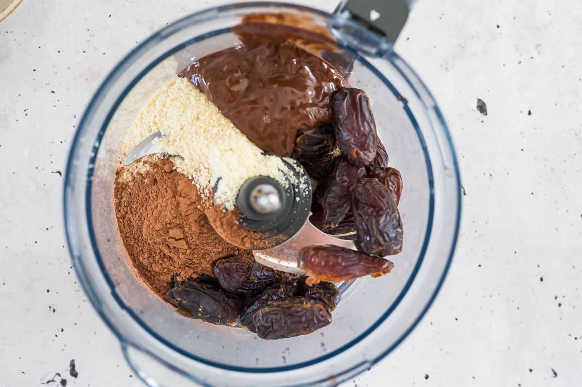 chocolate date ball ingredients in food processor before blitzing