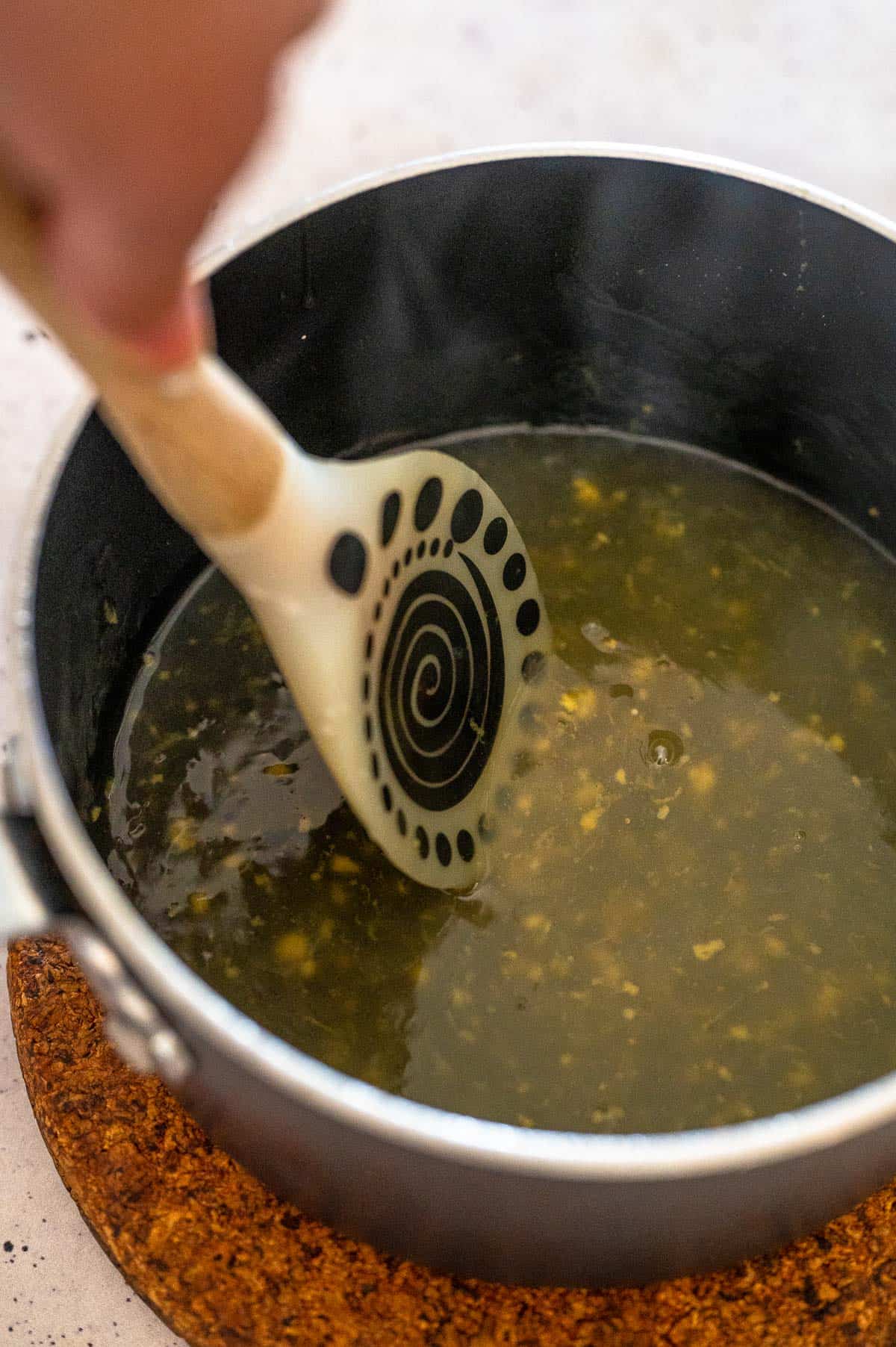 lemon sauce in a pot with spoon