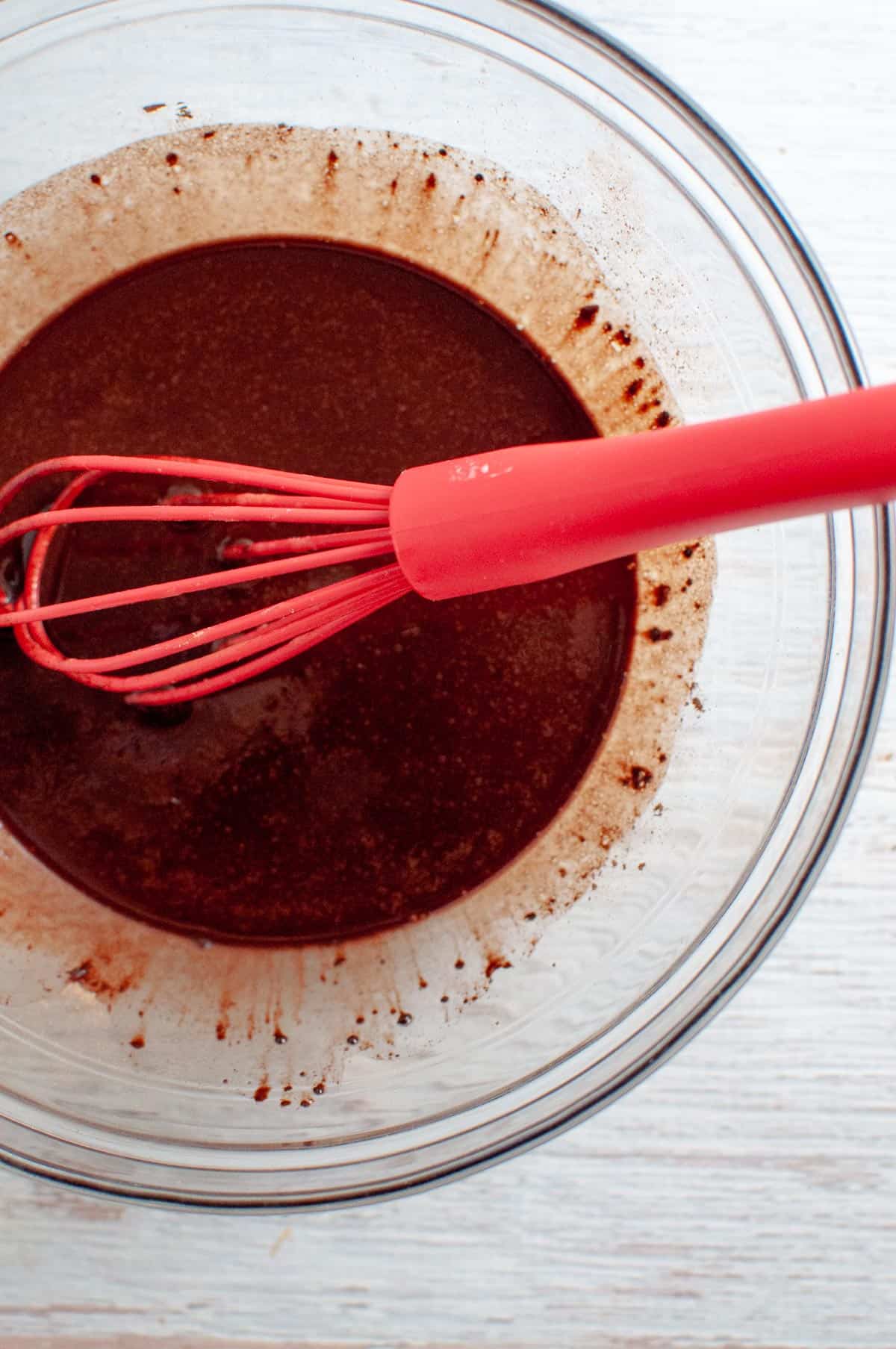 whisking chocolate top layer in bowl