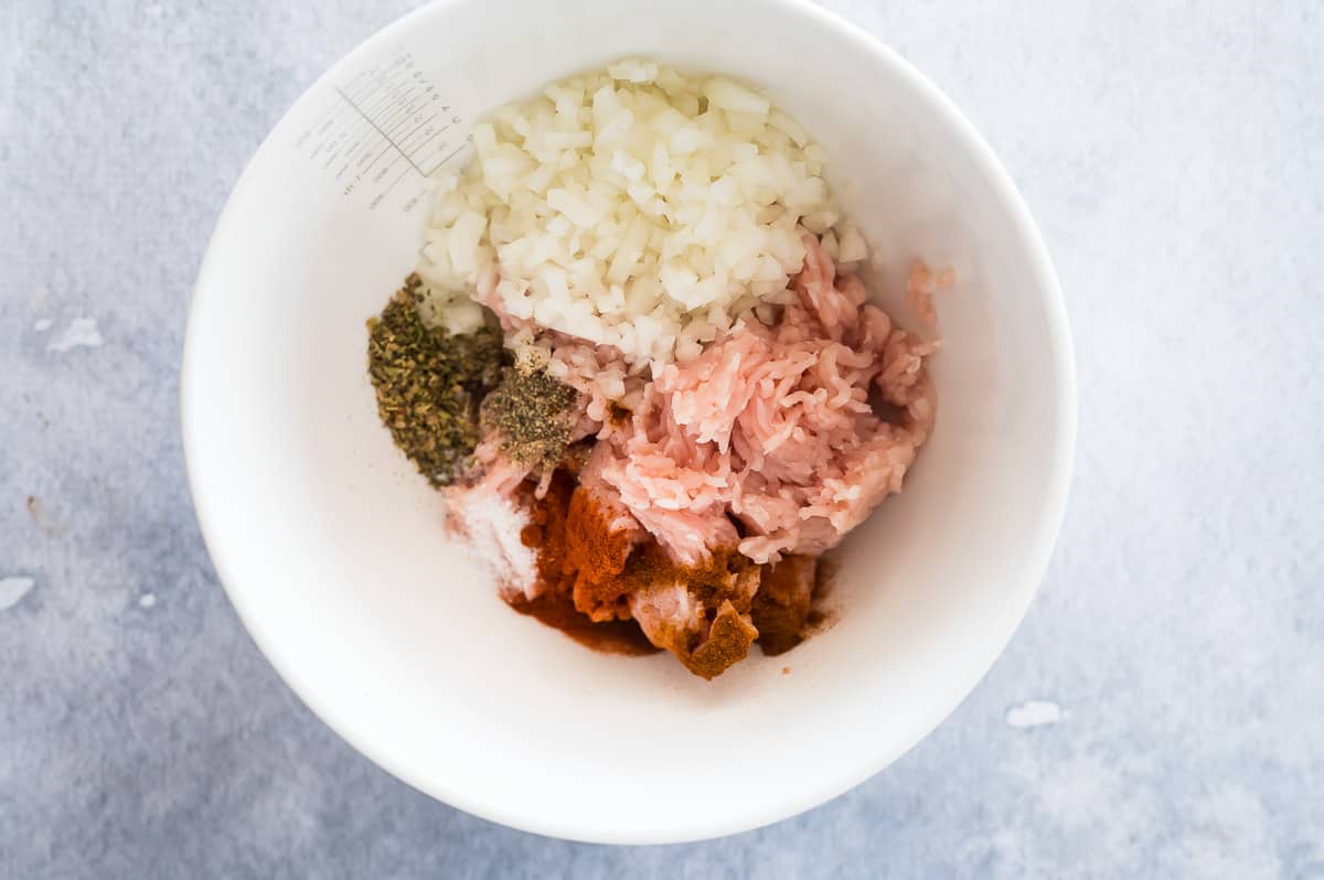 meatball ingredients in a white bowl