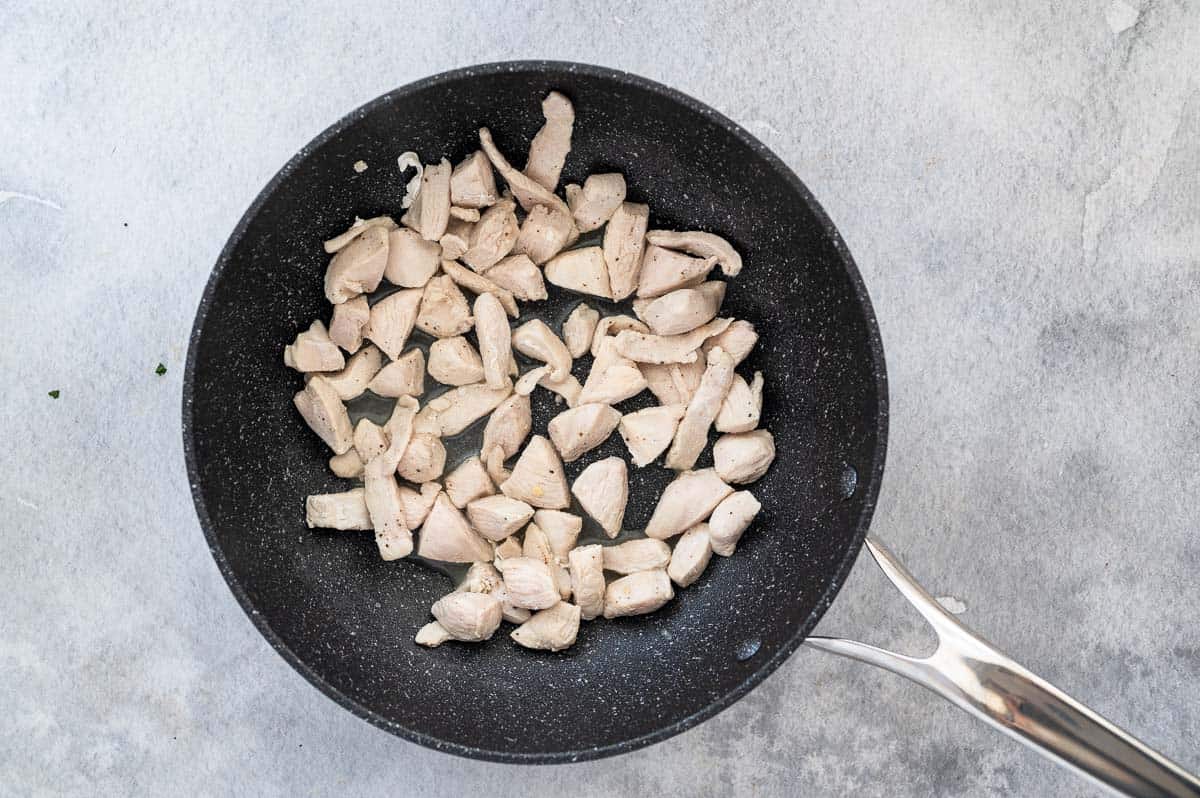 cooked chicken in  a wok