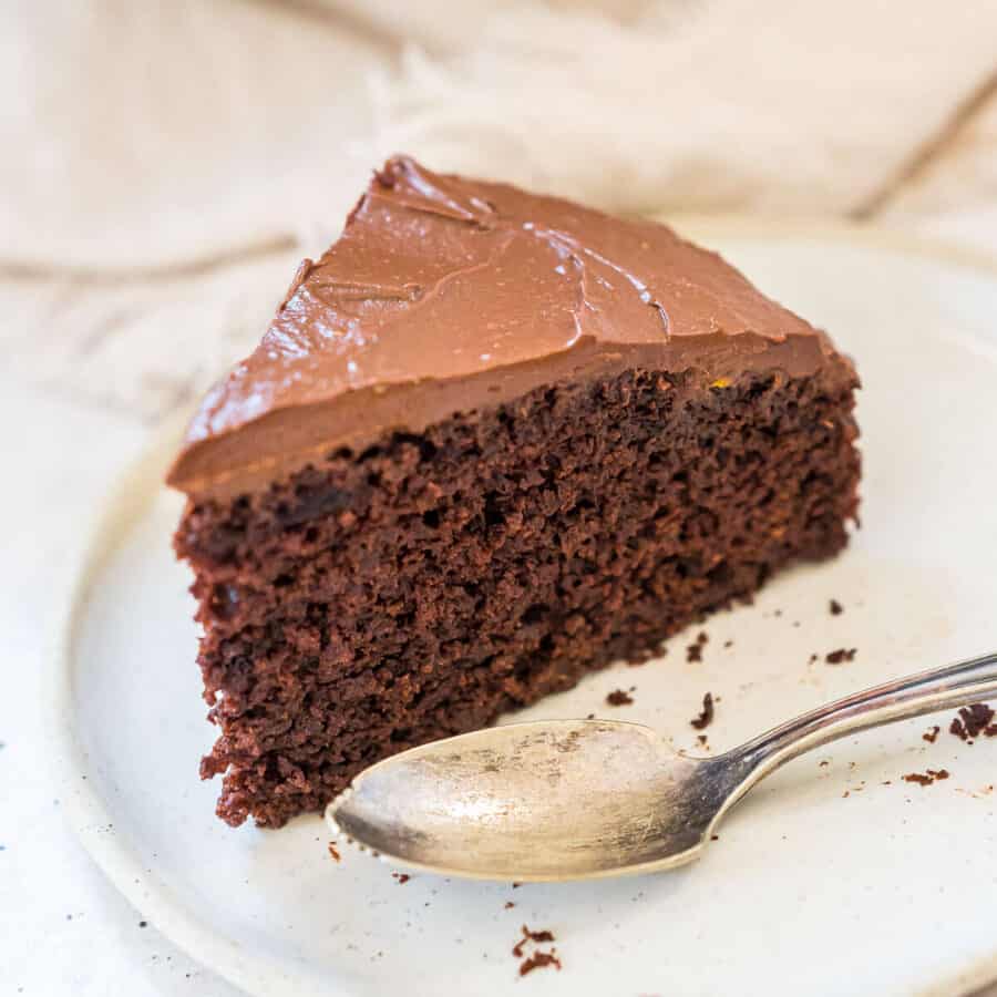 a slice of chocolate cake on a plate with a fork