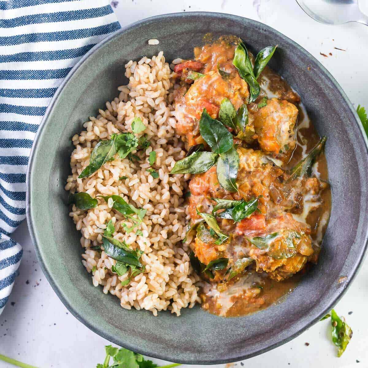 butter chicken meatballs with rice in a bowl