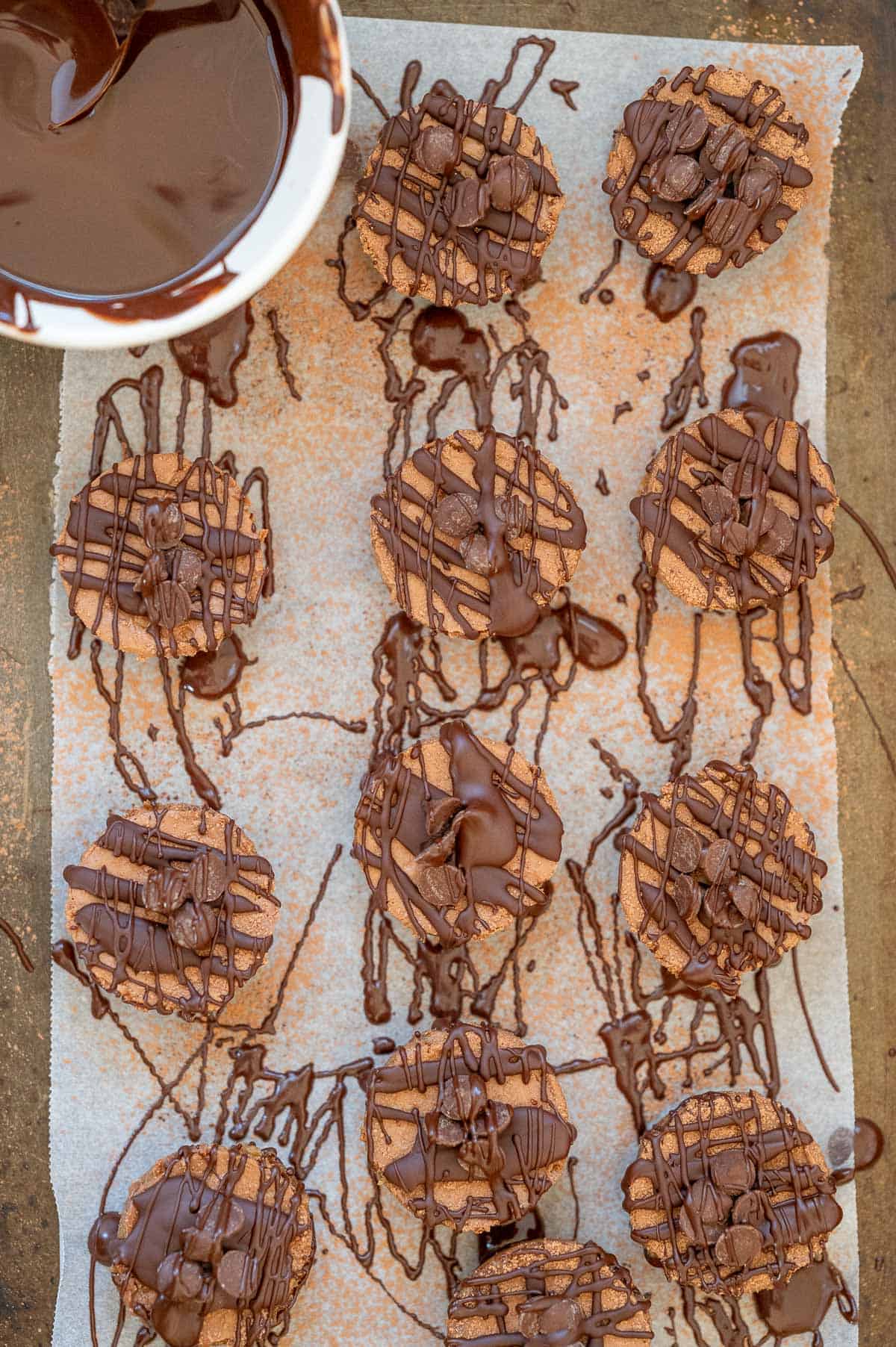 cheesecakes on a tray with chocolate drizzle