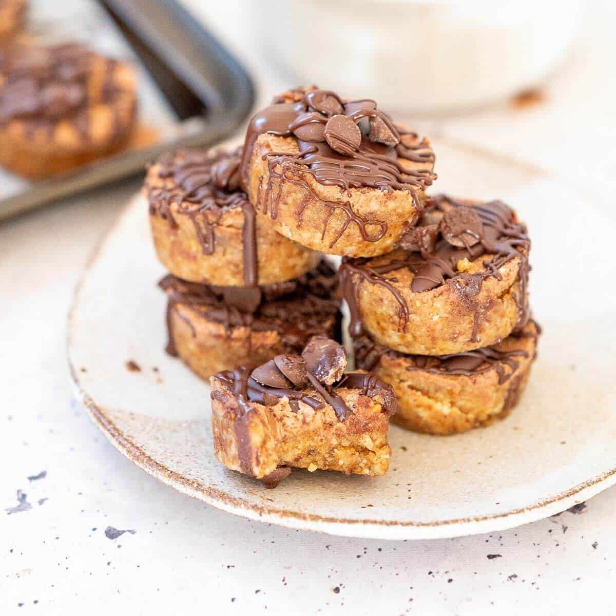 six stacked mini mocha cheesecakes on a plate