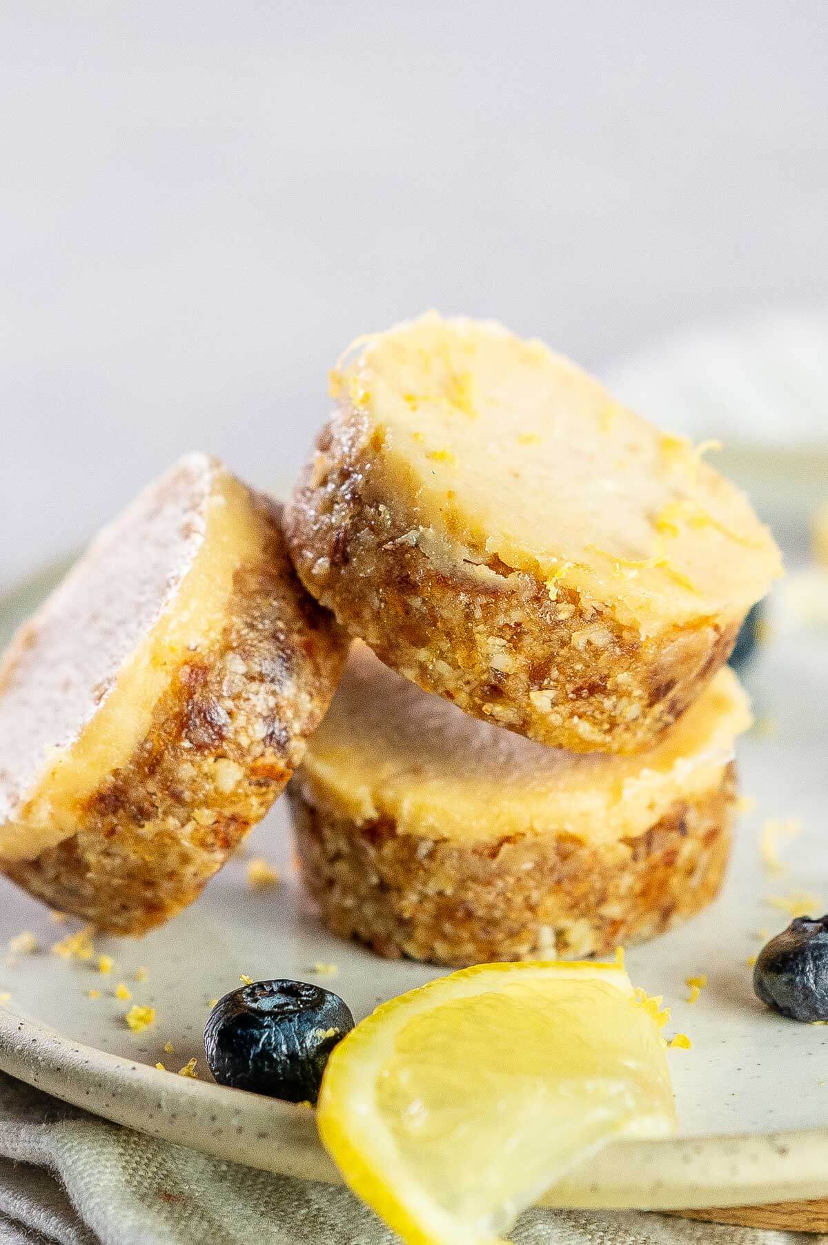 3 mini lemon cheesecakes leaning on each other