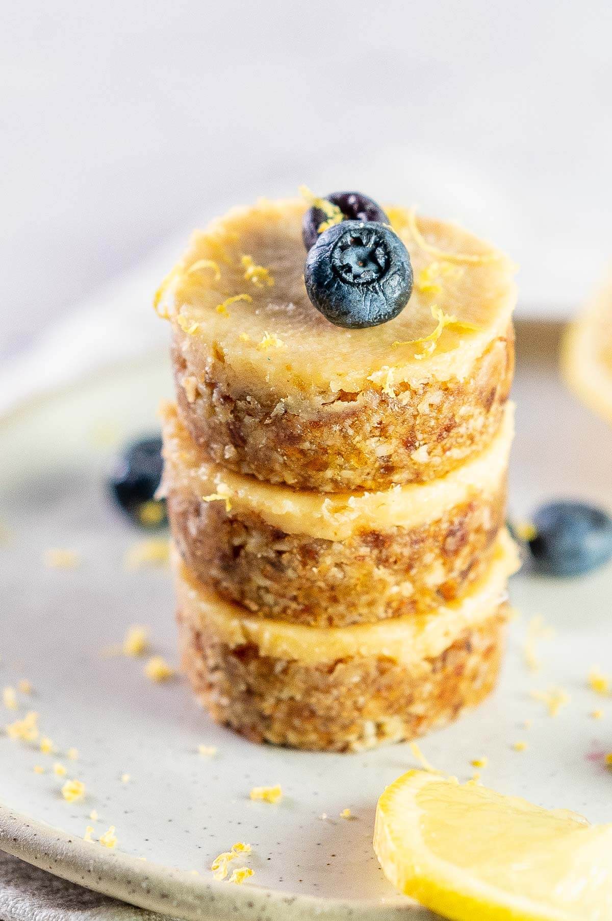 a stack of 3 mini lemon cheesecakes