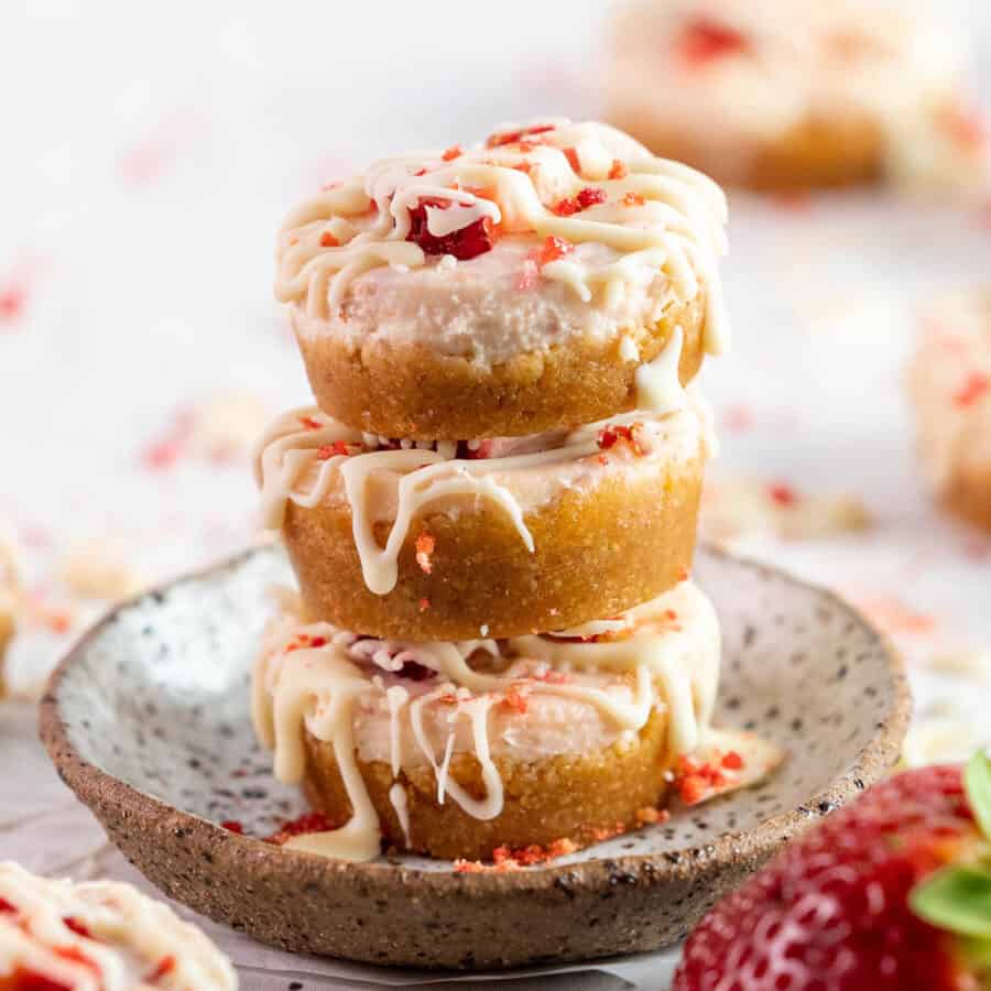 a stack of 3 mini strawberry cheesecakes