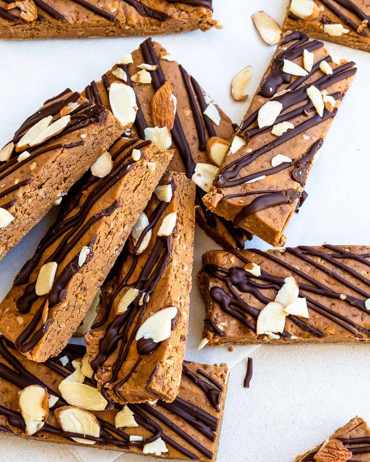 no bake protein bars with chocolate scattered on table