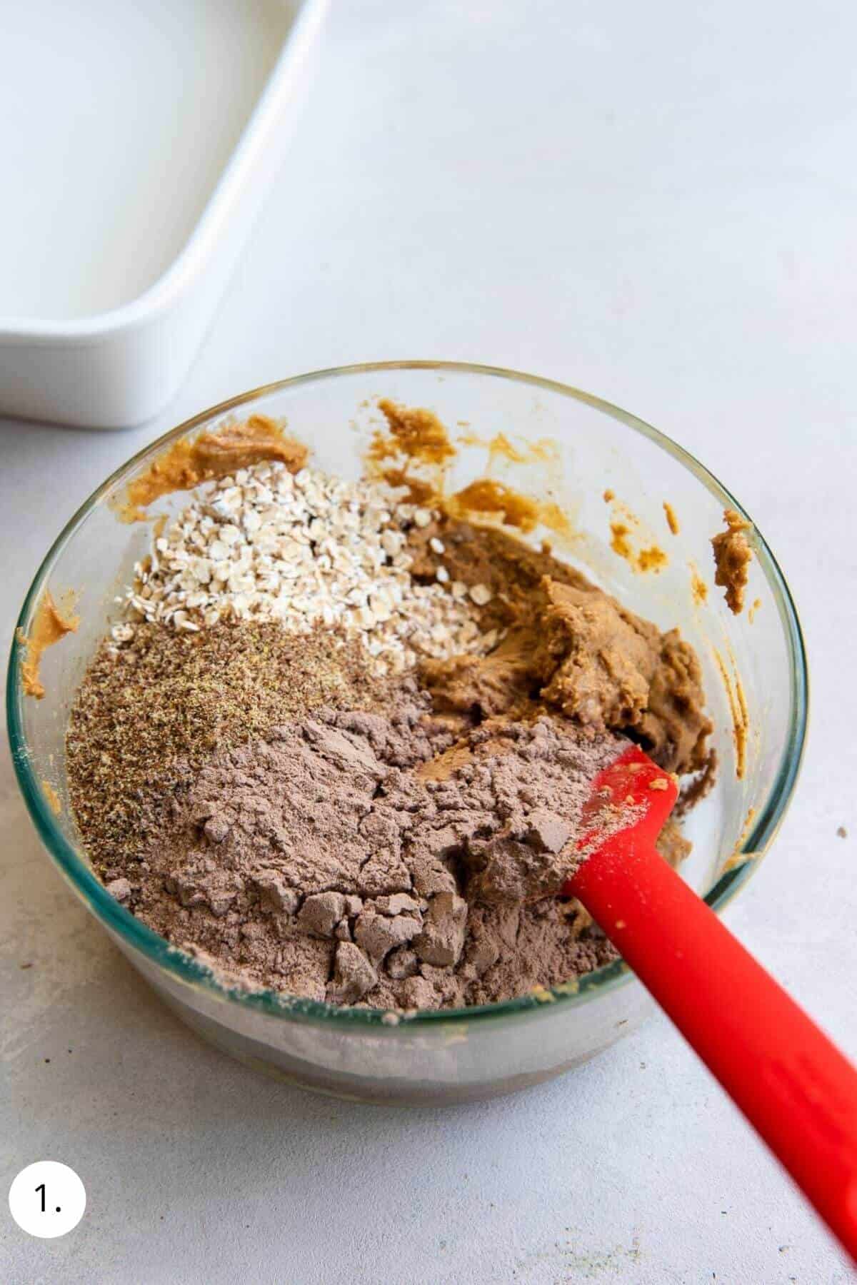 mixing no bake protein bar ingredients in a bowl