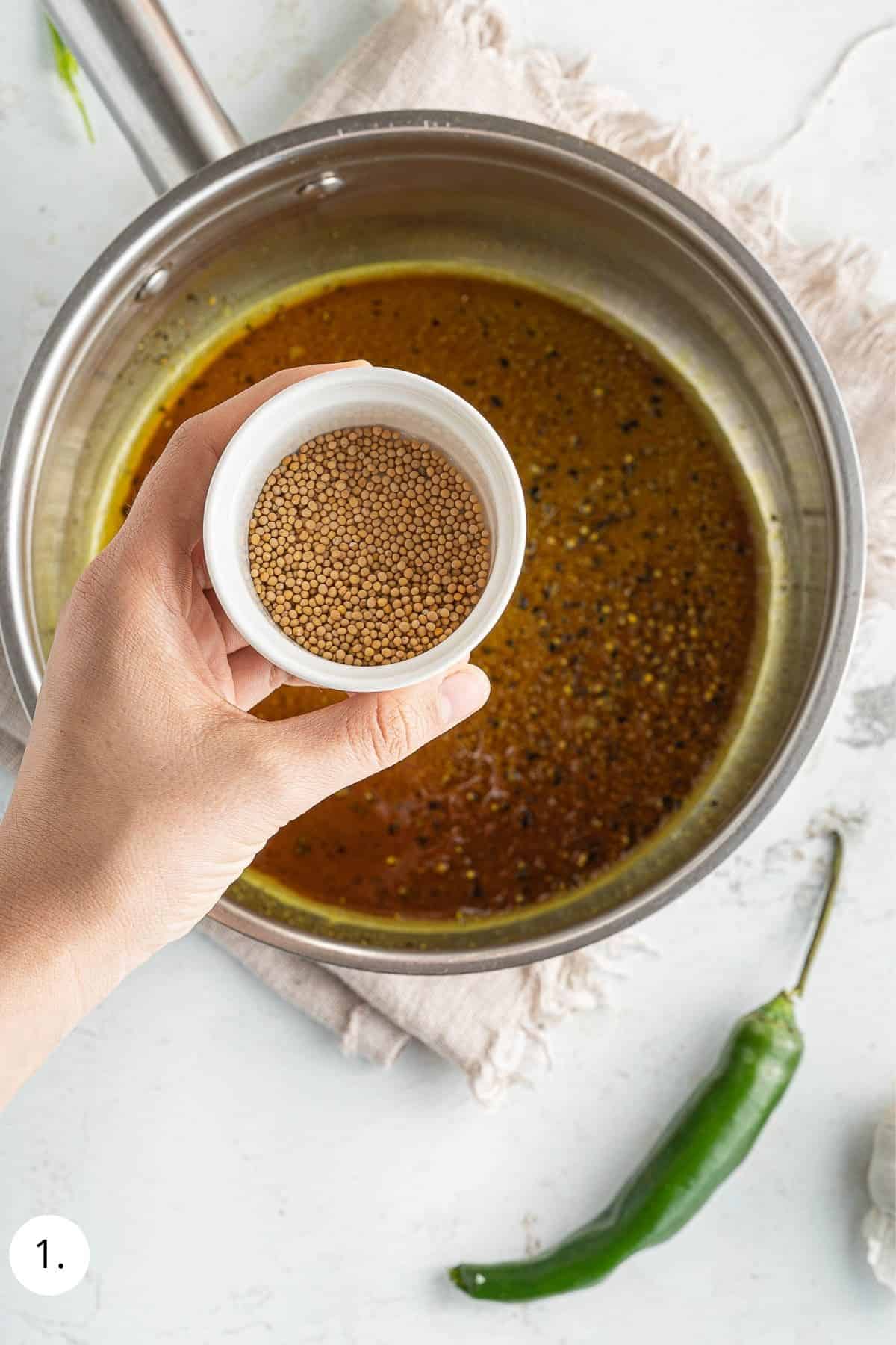 cooking spices in a pot with coconut oil