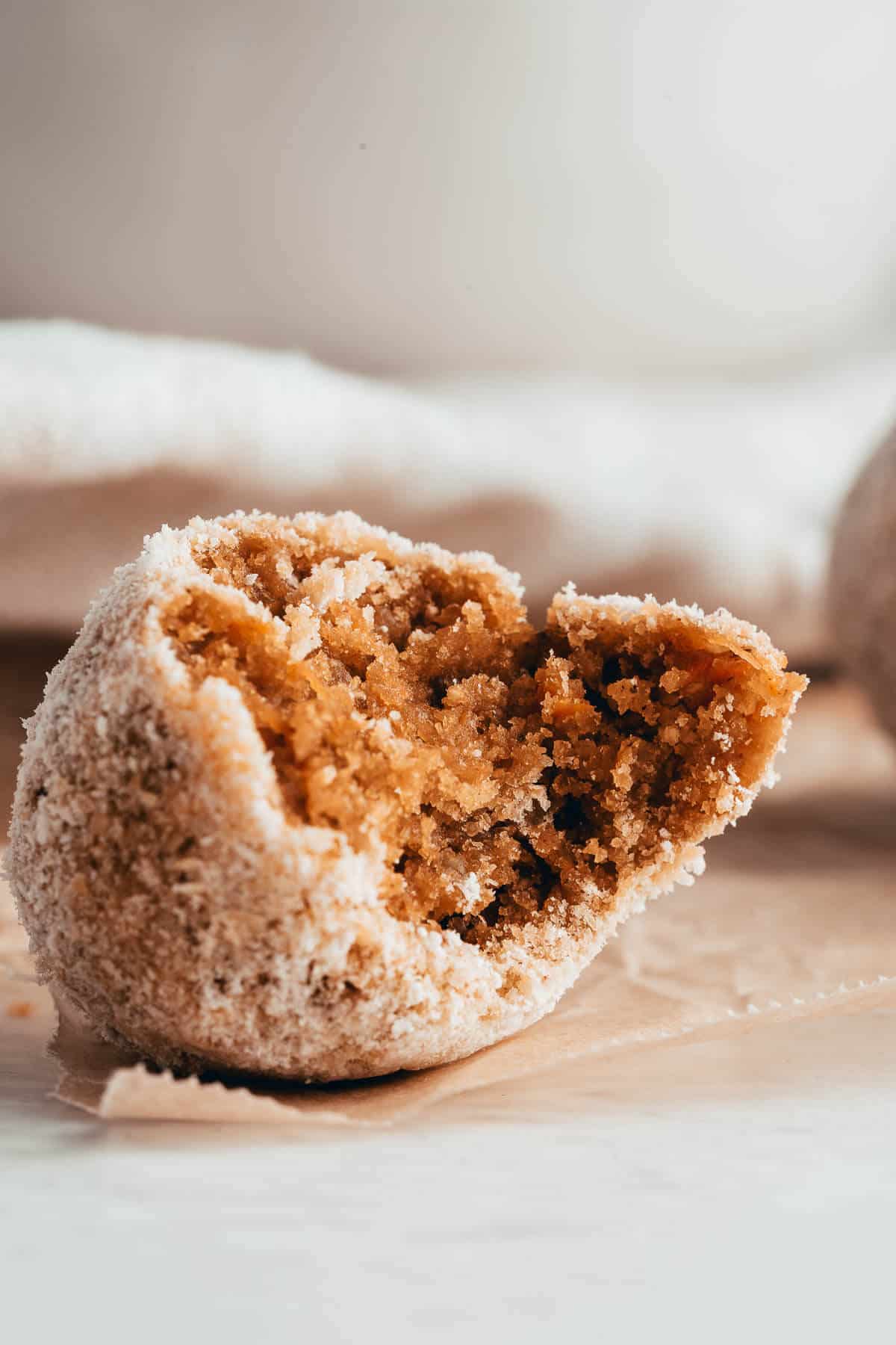 carrot cake bliss ball with a bite out