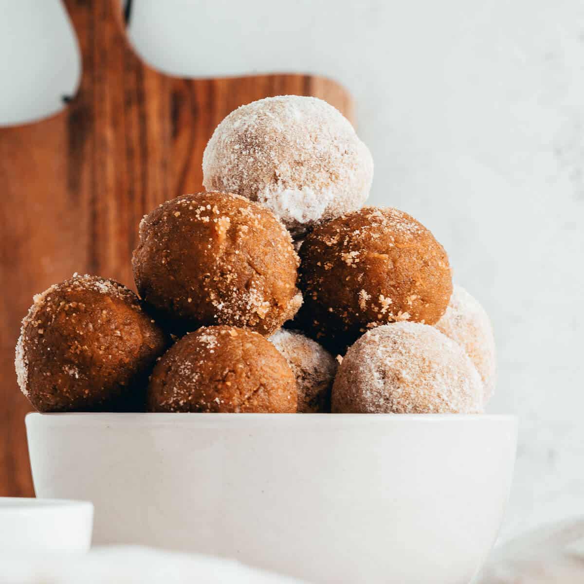 carrot cake balls stacked in a bowl