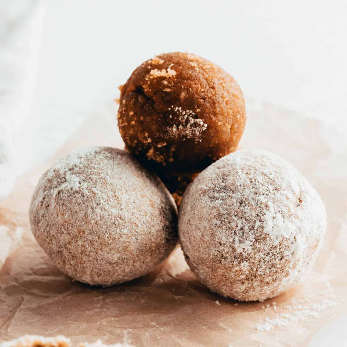 3 carrot cake balls on brown paper