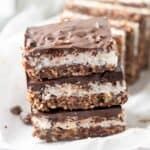 3 stacked double chocolate coconut bar close up
