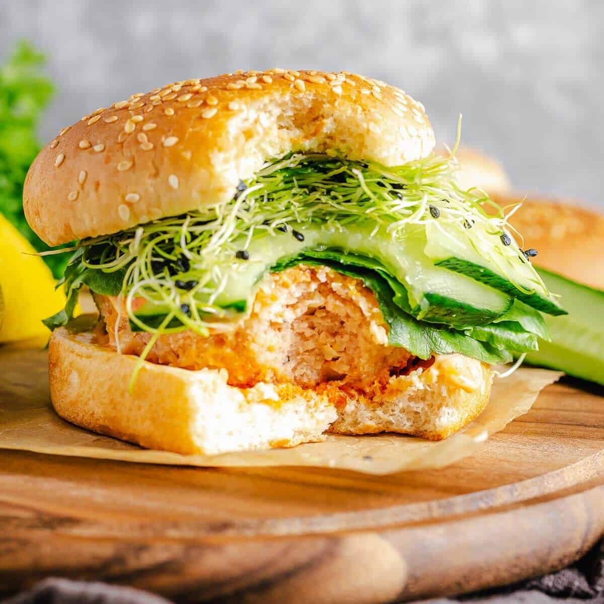 salmon burger with a bite taken out