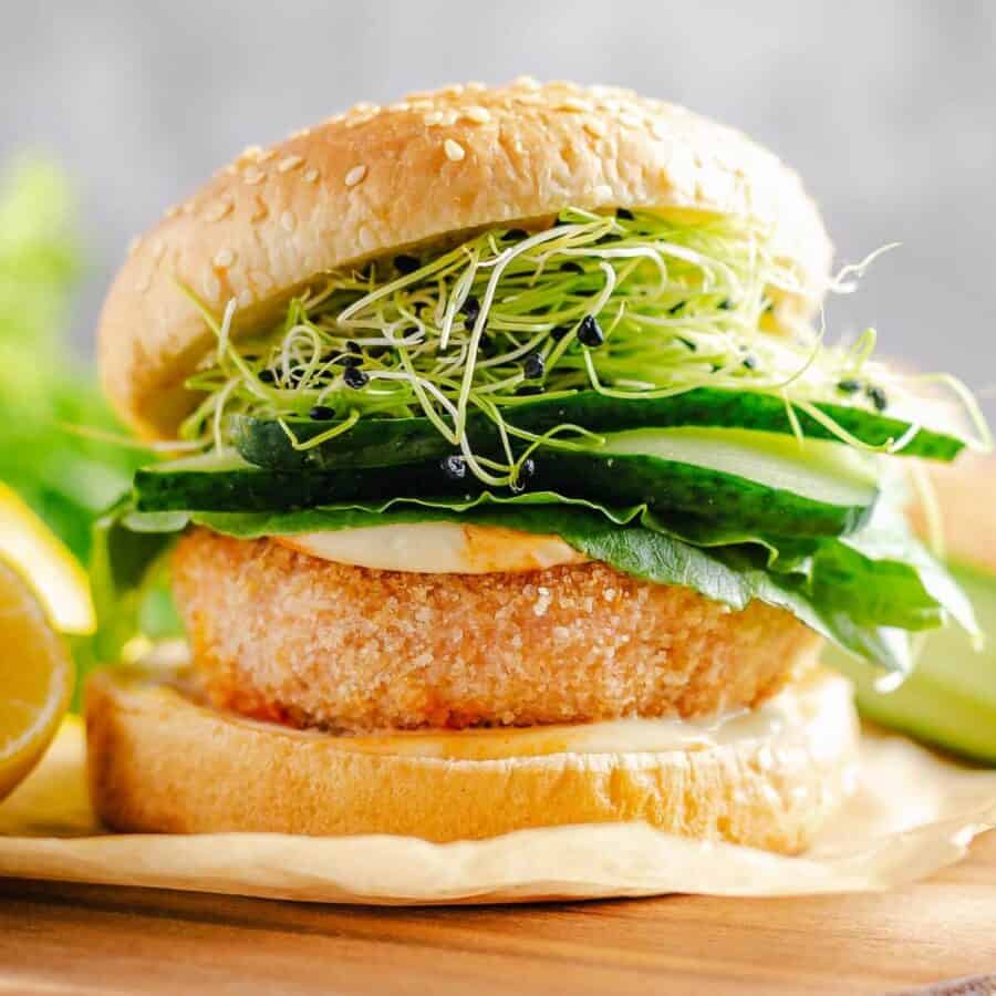 Salmon burger and salad on a bun