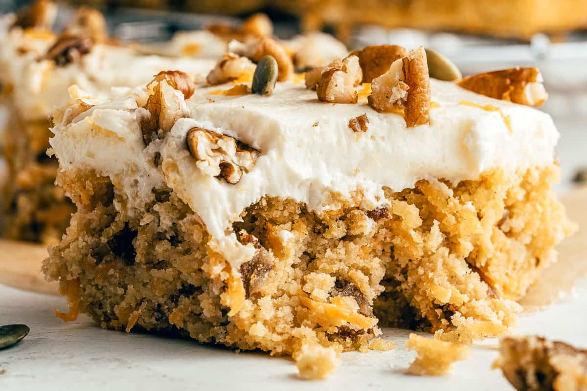 carrot cake square with a bite taken out