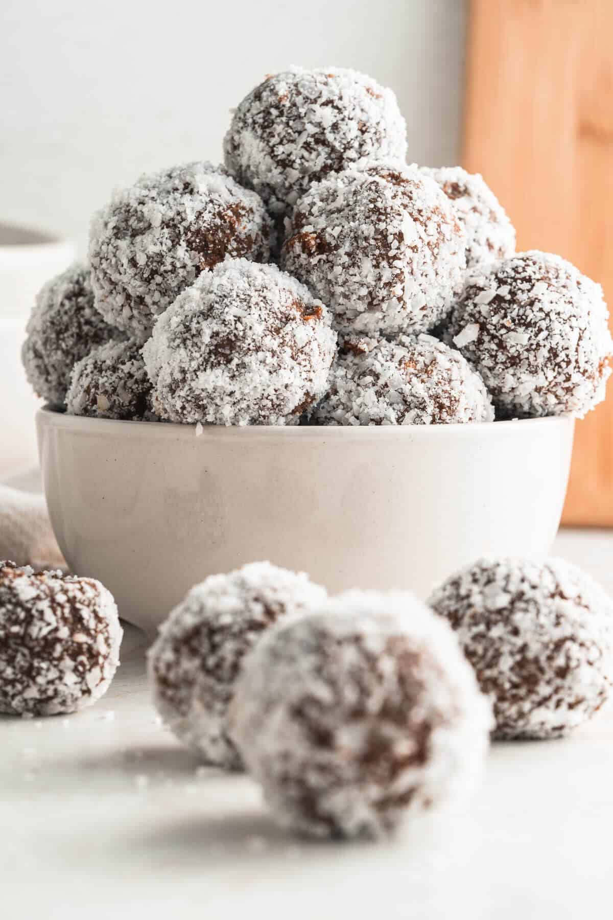 a white bowl filled with sweet potato truffles