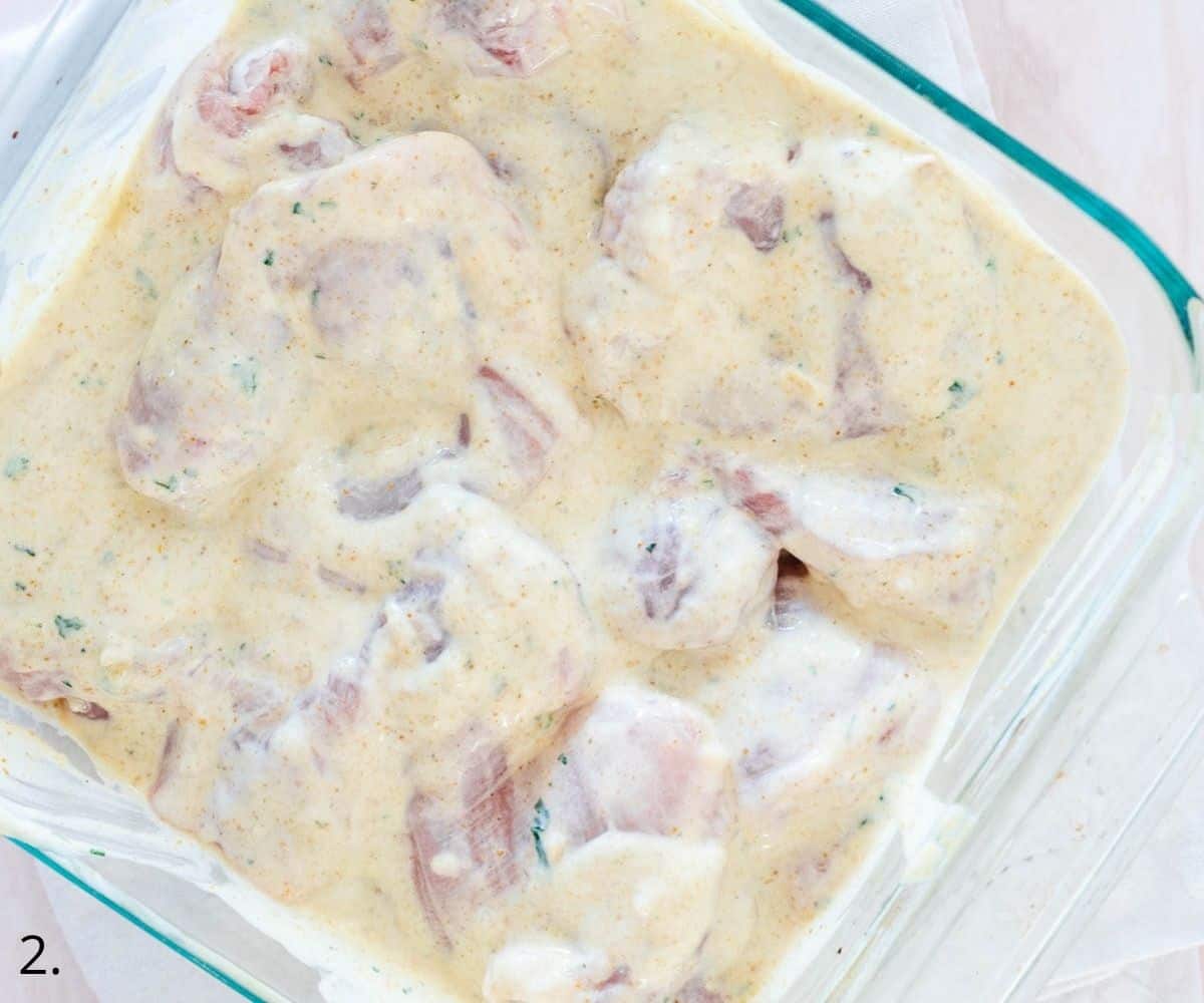 chicken thighs marinating in greek yogurt