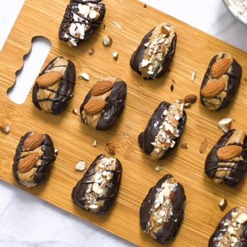 11 peanut butter stuffed dates on a board