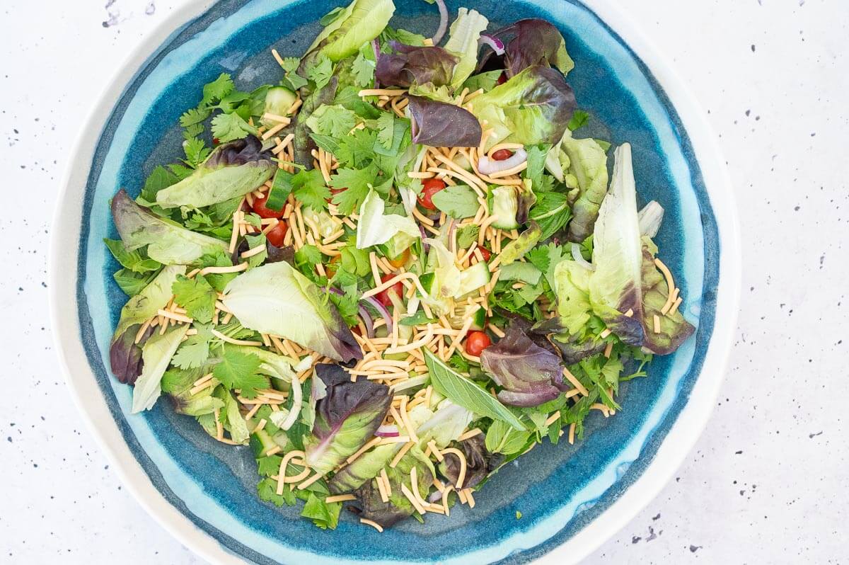 salad ingredients for thai beef salad in a bowl