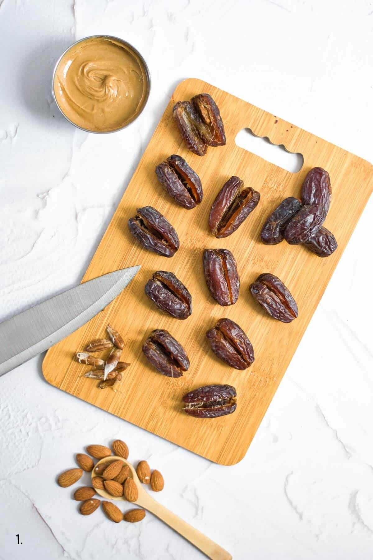 medjool dates on a board sliced down middle