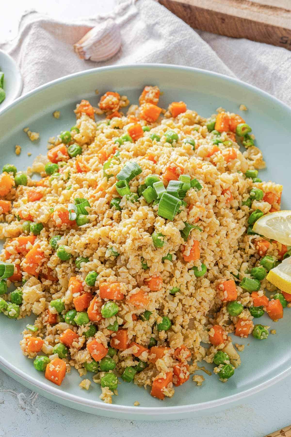 a large aqua plate with cauliflower fried rice