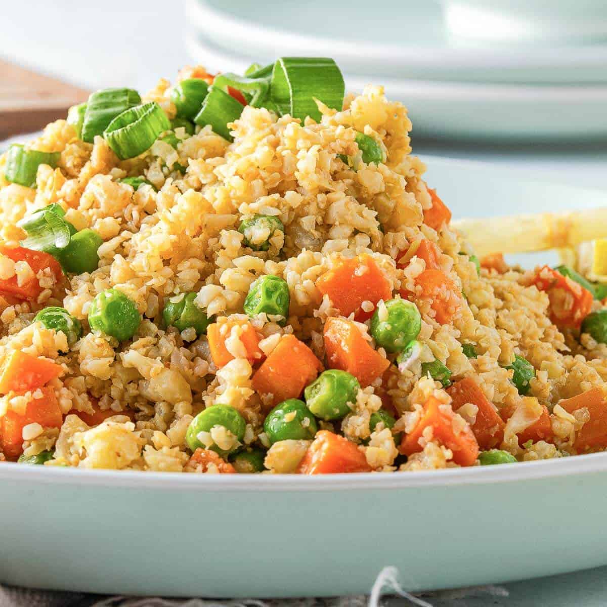 side angle of cauliflower fried rice in a bowl