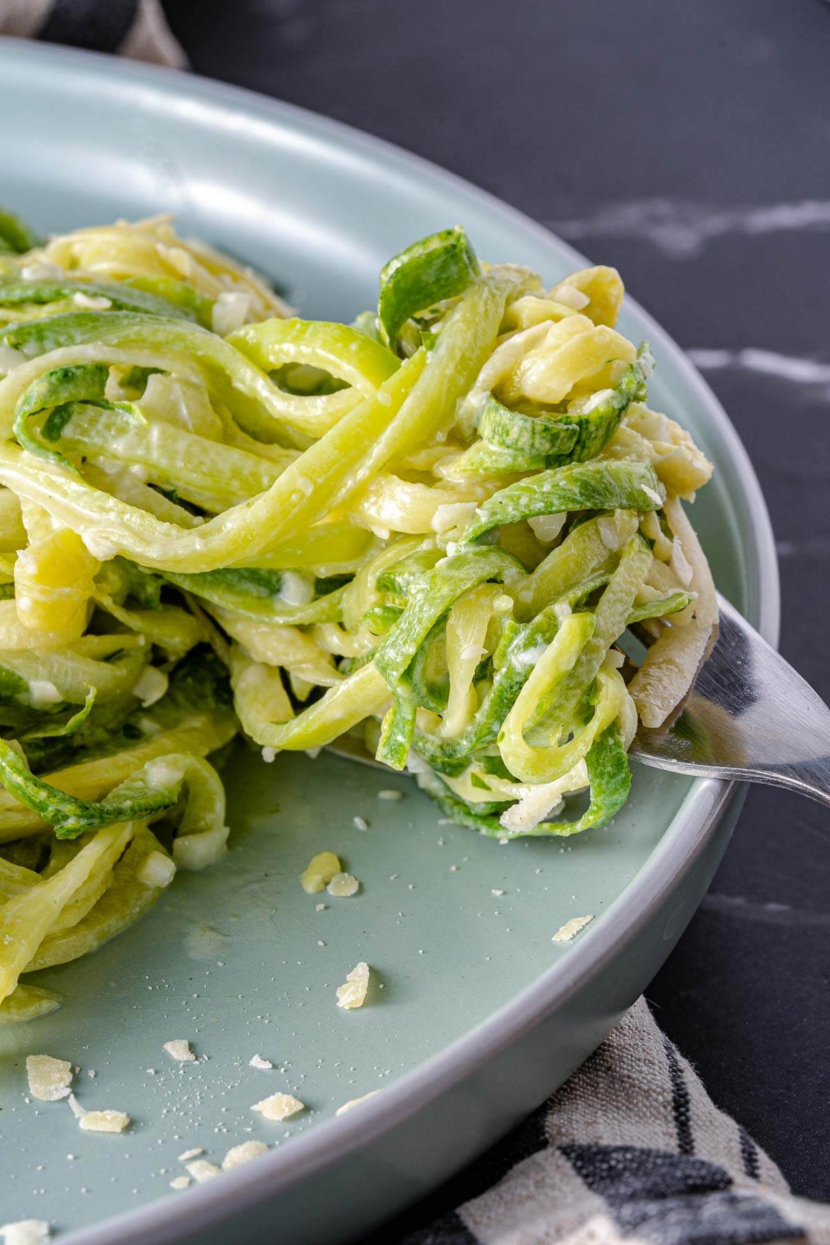 zucchini noodles curled around a fork ready to eat