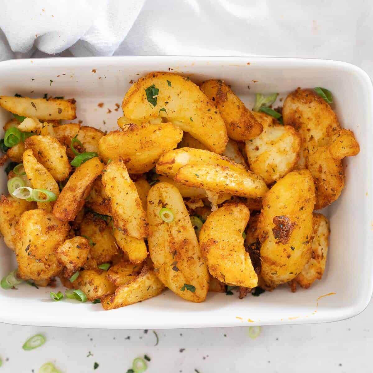 Air fryer smashed potatoes in a rectangle dish