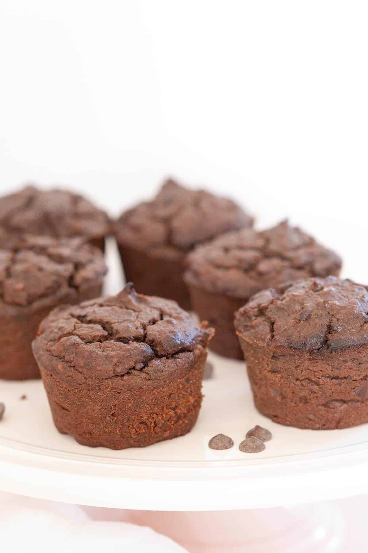 chocolate black bean muffins in a pale pink serving platter
