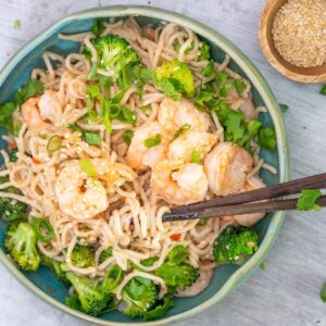 prawn noodle stirfry in a blue bowl