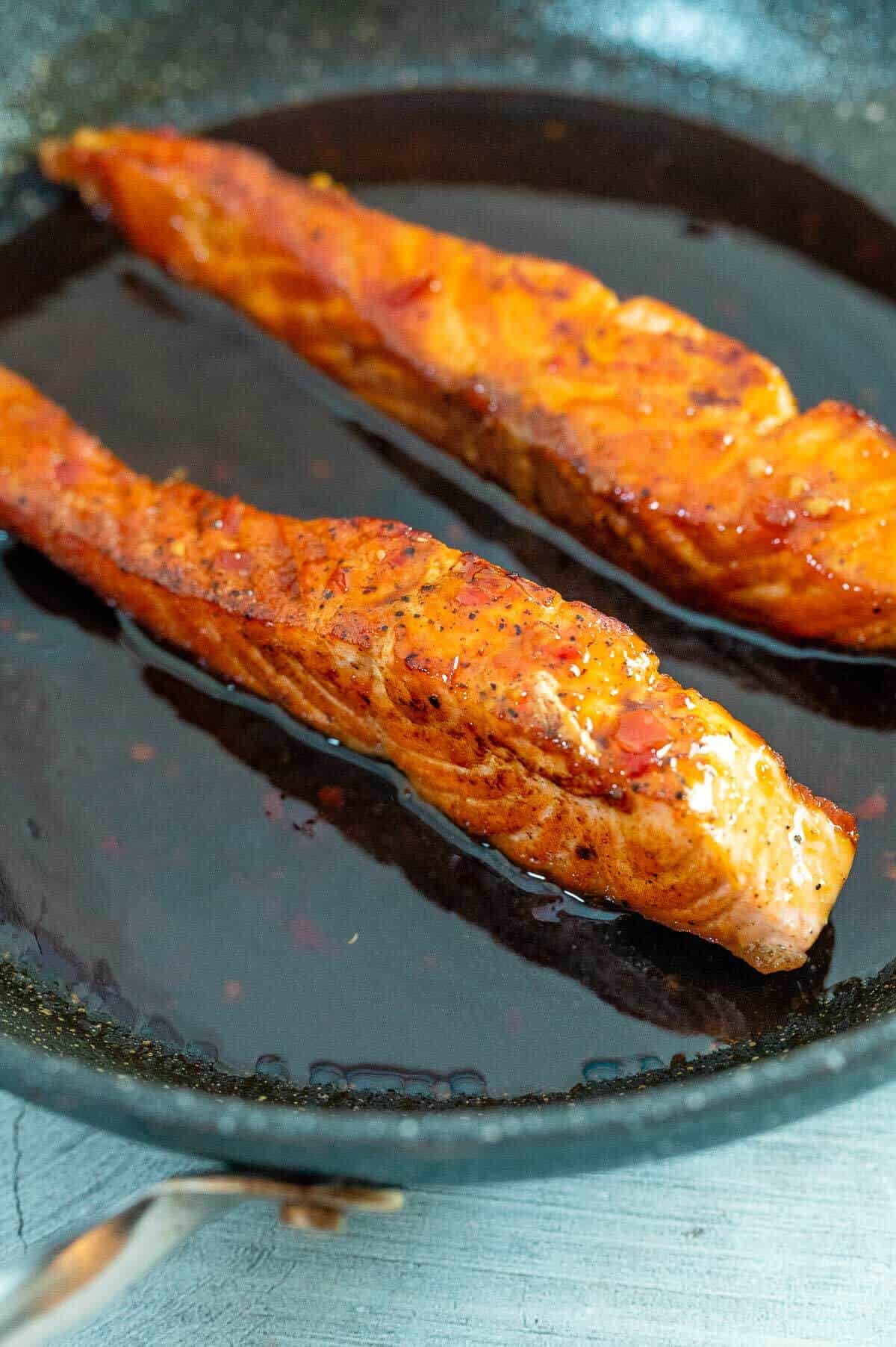 salmon fillets in a glaze in skillet