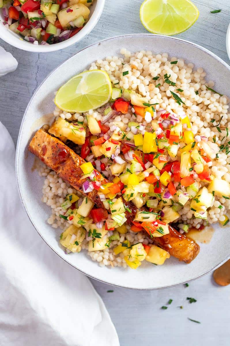 salmon with pineapple salsa with lime wedge 